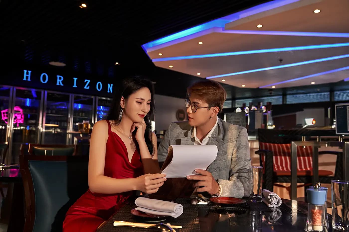A couple reading the menu at Horizon bar, Four Points by Sheraton Danang