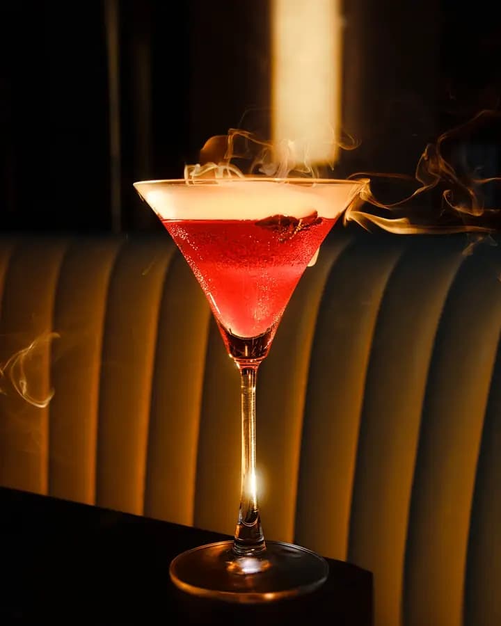 A red cocktail on a dark bar, Hilton Garden Inn Danang